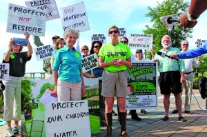 Jacksonville media turn out for the Green Slime protest on Apr. 15. St. Johns Riverkeepr Lisa Rinaman,  right, and Janet Stanko, chair of the Sierra Club of Northeast Florida, speak about the toxic effects of algae outbreaks in the rivers