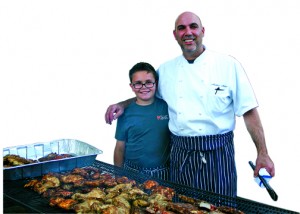 RPDS third grader Charlie Medure with chef dad and Capers caterer Matthew Medure