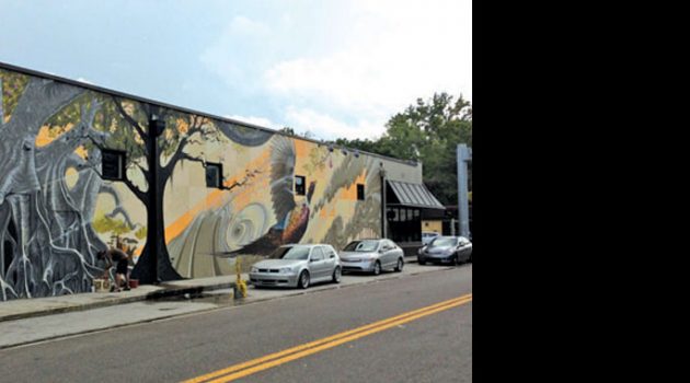 Local muralist transforms popular tagging wall
