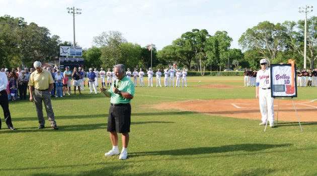 Throwing out first pitch,  Bolles legends retire jerseys