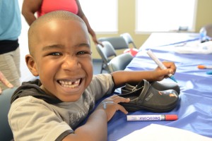 Deon Wilson, 5, was all colors and smiles as he made his artistic statement.