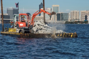 Barge workers place concrete rubble at one of two artificial reef sites in the St. Johns River. Photo courtesy of Joe Kistel 