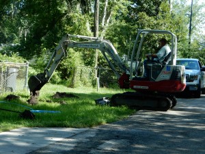 Tommy Geoghagan of Miranda Contracting digs a trench as to lay water pipes in the Larsen neighborhood.
