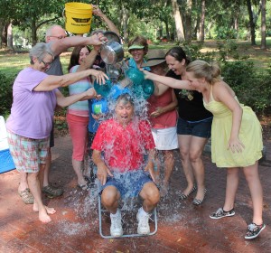 Harold McKeon gasps in shock as friends dump icy water on him in support of his fight against ALS.