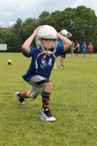 Hands on helmet, this youngster is in perfect lunge form.