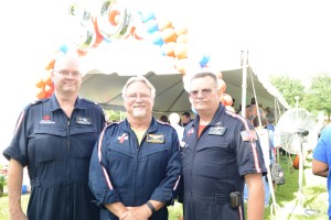Joe Gerard, lead dispatcher, John Barber, lead pilot and Wes Eskew, an original paramedic, enjoy the festivities at TraumaOne’s 30th anniversary celebration.