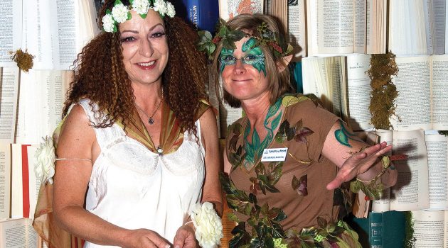 Costume-clad party-goers benefit adult reading programs