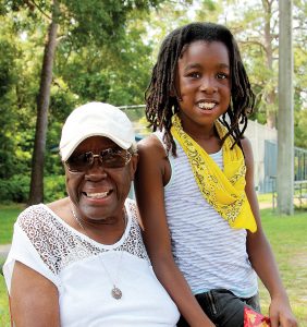 Mildred Taylor, with great-granddaughter Maci Bland, is one of the original volunteers with RBI (Reviving Baseball in the Inner City)