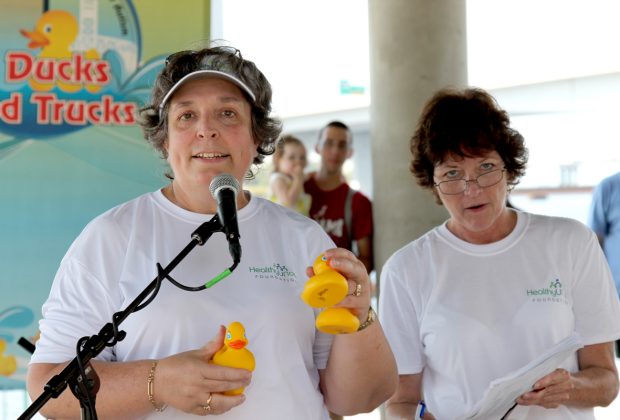 HealthyUNow founder Dr. Julie Buckley announces the winners of the Rubber Duck Race to benefit HealthyUNow.