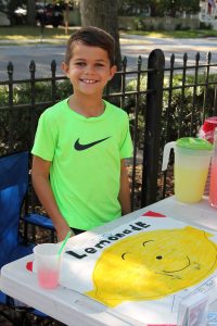 Budding entrepreneur Reed Krueger sells lemonade at the new playground to benefit the St. Augustine Hurricane Matthew Relief Fund.