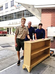 Troop 2 Boy Scout Gannon Nolan stands beside a bookcase he made for the St. Vincent’s CCU as part of his Eagle Scout project. Also in the photo is Randy Kalka, a Scout parent who helped with Nolan’s project and John Monteleone, a Scout also in Troop 2.