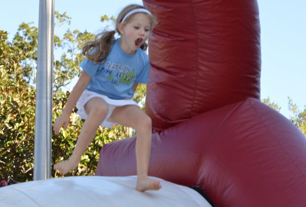 Stella Krueger enjoys a trip down the slide during the Ryan’s Run event at Ortega United Methodist Church Nov. 5.