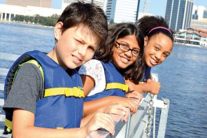 Looking over the rail of the river taxi are fifth graders Brodie Hartman, Jalia Santiago and Gaby Persaud of Brookview Elementary School.