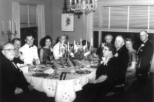 Dr. Robert McIver hosts a dinner party for the Florida Medical Board around the table that was a precious gift to his wife, Ida.