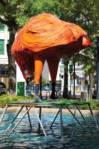 Hemming Park lost its most recent quirky work of art when Snacker, a giant orange chicken, found a new home.