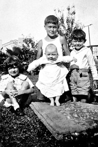 Rogers children in 1932: Walter supporting Henry; twins Minerva (left) and John (right)