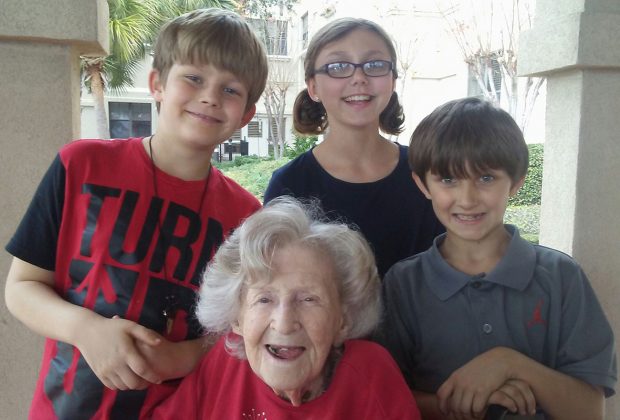 1939 Fishweir graduate Faye Murray Armes with her great-grandchildren Bo, Alicia and Ethan, who all attend Fishweir Elementary School.