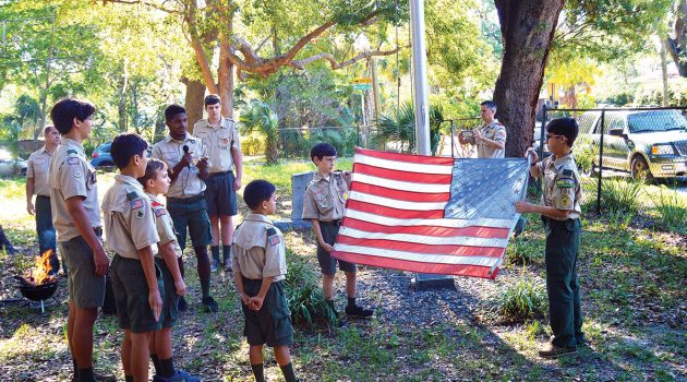 Boy Scouts retire old flag in Historic St. Nicholas Cemetery