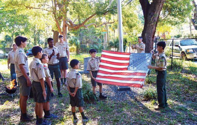 Boy Scouts retire old flag in Historic St. Nicholas Cemetery