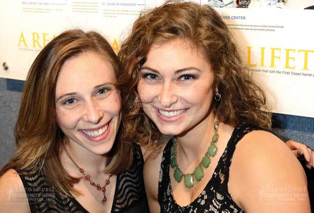 Sisters Rebecca and Naomi Levin help to sell vintage, limited-edition bangles during the silent auction.