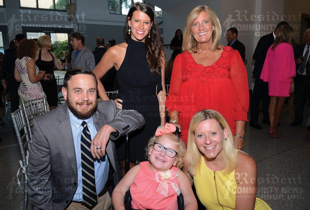 The Sproles family and close relatives celebrate Norah, who was born with spina bifida and receives much of her specialty care from the staff and physicians at Nemours. Barry Sproles with Molly Rausch and Beth Rausch, honoree Norah Sproles (in front) with her mother, Megan Sproles.