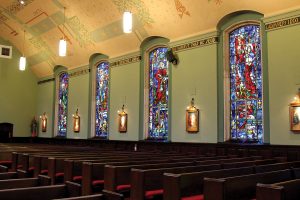 The four stained glass windows at St. Paul’s Catholic Church which depict the Gospel writers.