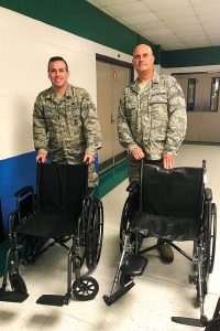Air Force members receive Durable Medical Equipment at Landmark Middle School from the Independent Living Resource Center.