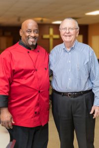 Former City Rescue Mission client Ronn Scott stands with his mentor, Bud Toole