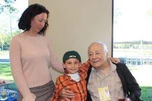 Irina Spinella, with her father, Holocaust survivor Nathan Koifman and her son, Ken. Koifman was born in Odessa, Ukraine in 1931. His family moved to Moscow,  Russia. Then the war broke out and, in 1941, Koifman and his mother became one of the many families who evacuated to Uzbekistan by train. In 1943, they moved back to Moscow where his family worked in the military factories until the end of the war. “The Holocaust memorial will be a way to make sure future generations understand what we went through,” daughter Irina translated his Russian to English.