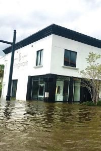 The floodwaters were high at the corner of Cedar Street and San Marco Boulevard where the Hollingsworth Showroom stands.