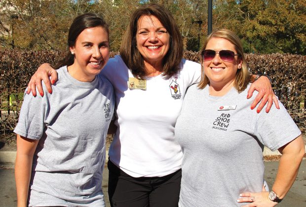 Ronald McDonald House Charities Executive Director Diane Boyle, center, with Red Shoe Crew members Rebecca Fontenot and Jen Cortner