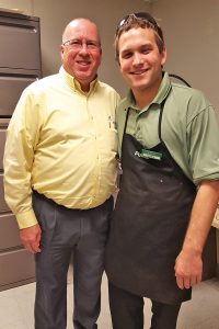 Publix Store Manager Jerry Bryans volunteers with Special Olympics, where Greg Myers, a Publix employee, has participated for the past eight years.