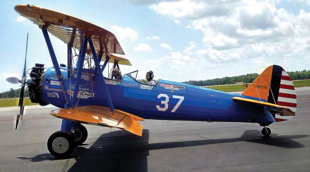 Military veterans take flight in restored biplane
