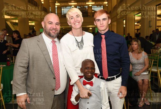Nathaniel and Heather Sprague with their sons Aaron and Jared. Nathaniel works for Coker Law, a presenting sponsor for Guardian ad Litem Foundation of Florida’s First Coast evening event.