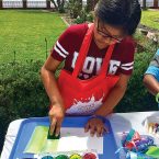 Aly Perez at a watercolor project  in the gardens.