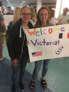 At the airport, Caroline Cavendish, right, welcomes Victoria Giesecke to Jacksonville.