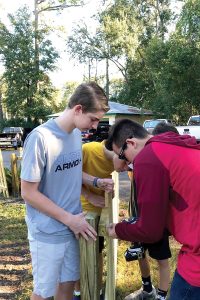 Mason Hicks, Sam Davis and Colton Champion work on Hick’s Eagle Scout project at Hendricks Avenue Baptist Church.
