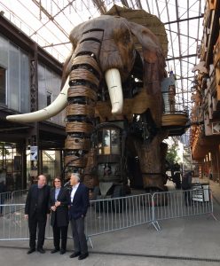 Jacksonville dignitaries provide scale for the 30-foot-tall elephant that has become a popular tourist attraction in Nantes, France.