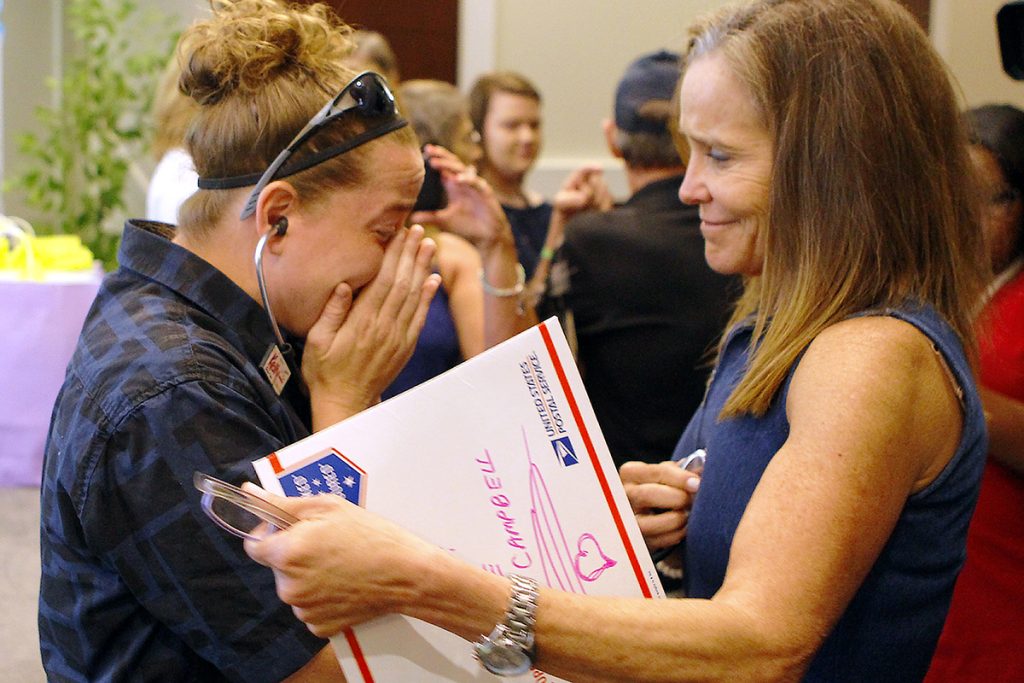 Jessica Moore cries as she hears her sister’s heart beat in Anne Campbell’s chest.