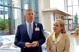 Keith Tickell, vice president of Strategic Assets – Real Estate and LeeAnn Mengel, administrator of Oncology Services at Baptist Health, answer questions during a tour of the new Baptist MD Anderson Cancer facility Aug. 31.
