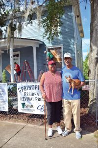 Debra and Raymond Thomas in front of their Springfield home.