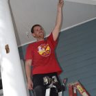 Joshua Wilkerson hangs a hook from the front porch during a renovation project for a home in Springfield.