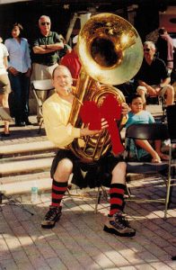 Larry Tallman plays the tuba at a  Jacksonville Tuba Christmas event