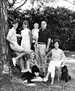 Jabbo Merrill holding grandson Nick, Roxie seated, daughter Roxanna Seely on the ground, son Jimmy and daughter Winky