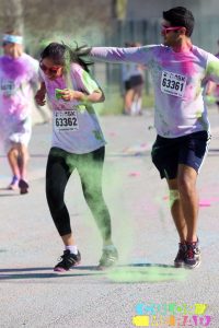 Sabeen Perwaiz and Asghar Syed in a 2018 Color Me Rad 5K race