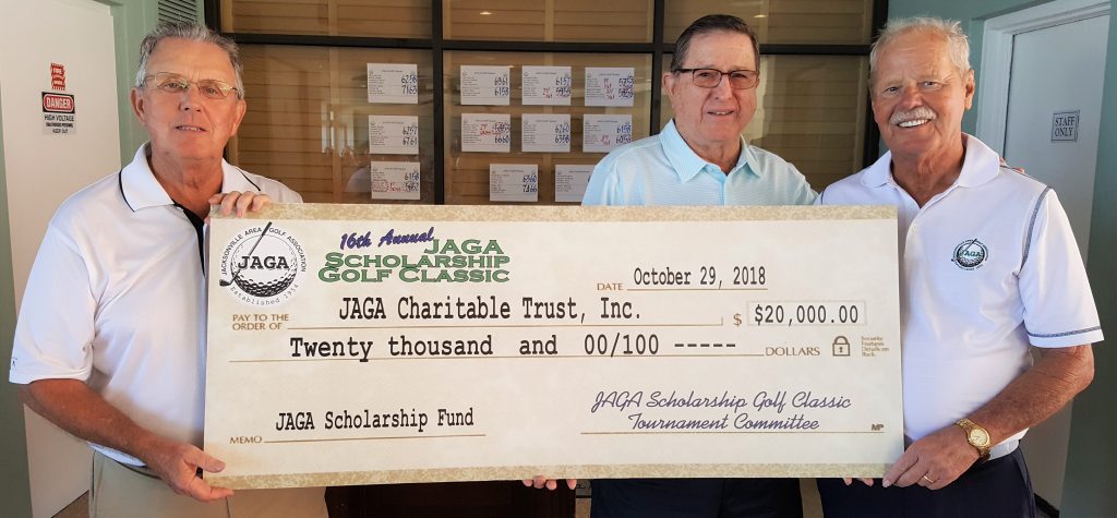 JAGA Scholarship Trust officers Bob Streightiff (left) and Ken Hicks (right), with tournament chair Adair Roberts.