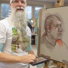 Self-taught artist Kevin Arthur with a work in progress