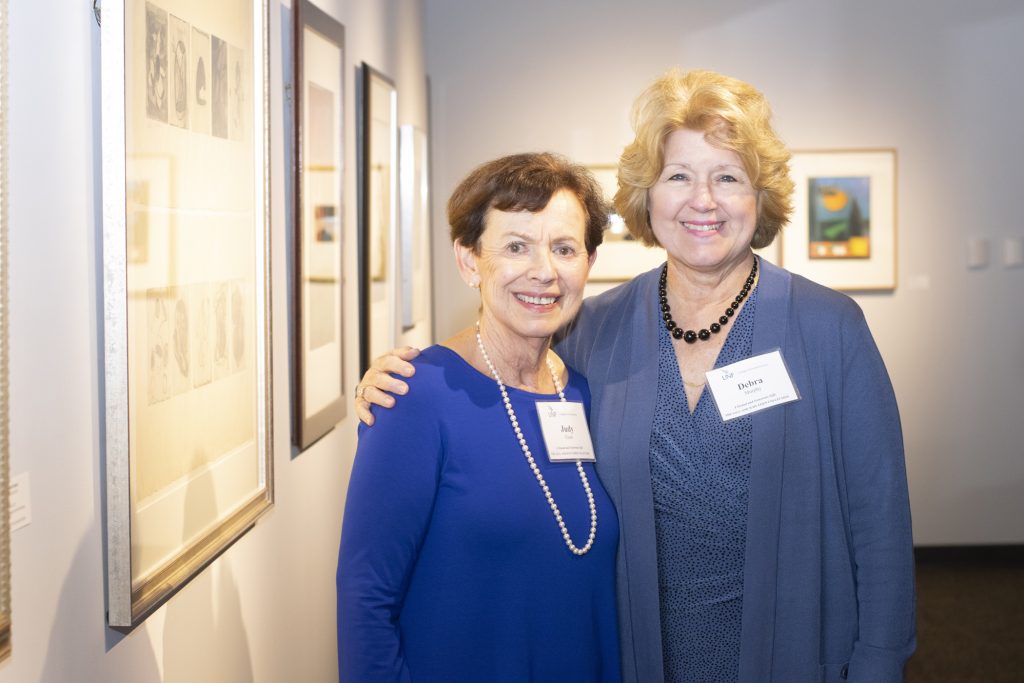 UNF Alumna Judy Eisen and Debra Murphy, chair and professor of UNF's Department of Art and Design, in the UNF Gallery of Art where Eisen's donation of artwork will be exhibited through Thursday, Feb. 14
