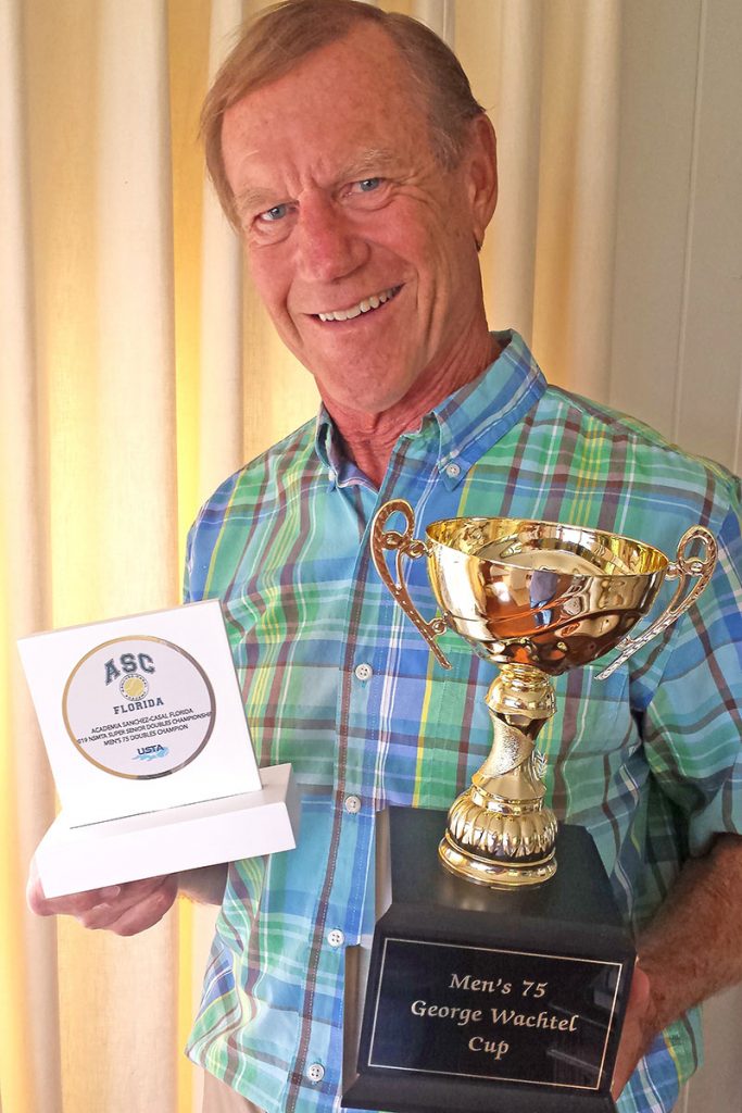 Chip Travis and a partner took the trophy in National Senior Men’s Tennis Association beating12 other teams to take top-ranking award.