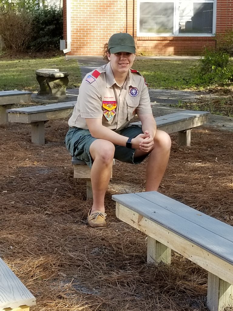 Christian Floyd with his finished Eagle Scout project, an outdoor classroom at Hendricks Avenue Elementary School.